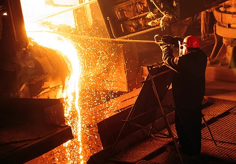Man working at an electric arc furnace
