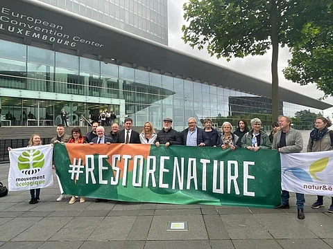  Irish Transport, Climate and Environment Minister, Eamon Ryan (Seventh from left, in dark jacket and tie) outside the European Convention Center in Luxembourg. 