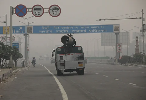 A truck mounted with anti-smog gun being used to spray water to curb air pollution in Delhi. 
