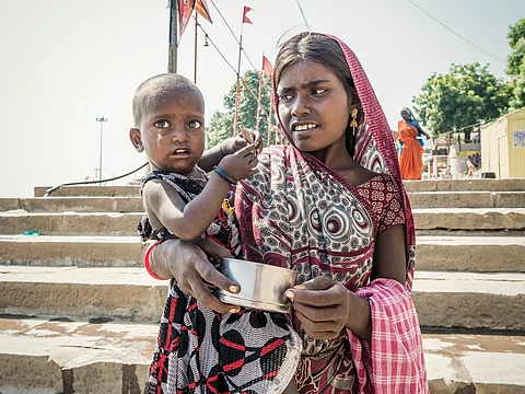 Climate change is hitting women the hardest. What to do about it — economists

