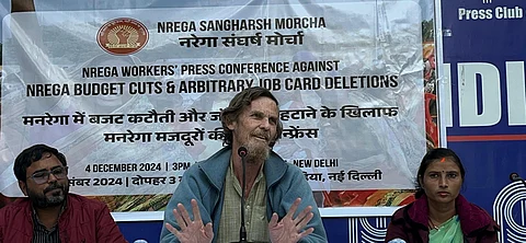 Jean Dreze speaks at the press conference in New Delhi.