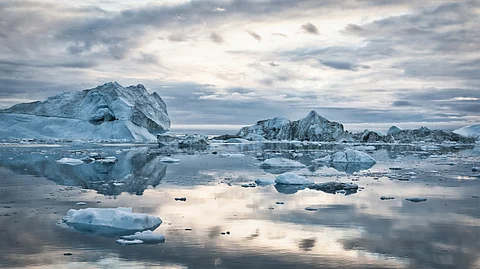 Greenland’s rapidly melting ice and landslide-prone fjords make the oil and minerals Trump covets dangerous to extract
