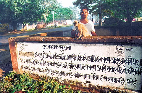 A signboard that reads, “This region is fire-affected”. 