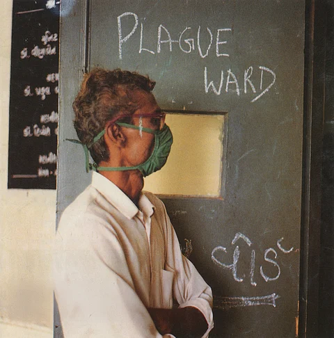 A man stands outside a plague ward in Gujarat