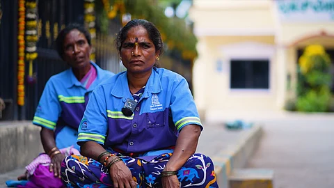 Workers like Nagalakshmi (front) played no part in Bengaluru’s transformation but are left to suffer its full impact.