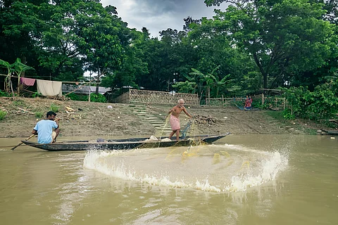 Lilaram Das casts his net into the Barak river near Niz Haritikar village — but like many fishermen here, he returns most days without a catch.