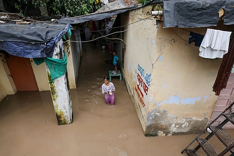 Residents along the Yamuna floodplains from Mayur Vihar to Yamuna Ghat in Delhi shift to relief camps and higher grounds as the river swells above the danger mark due to continuous rains. 