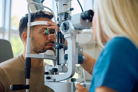 Young man having his eyesight tested at an ophthalmologist