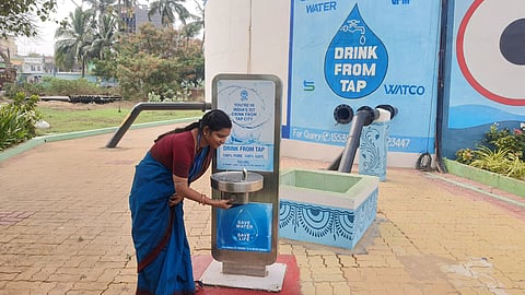A jalasathi demonstrating the quality of Odisha’s tap water.