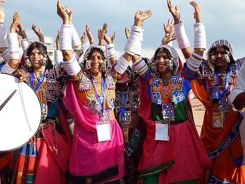 Members of Lambada community performing a traditional dance at a festival celebrations.