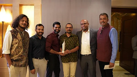 The DTE Multimedia team with the award. Photo: Prabhat Kumar / CSE
