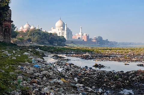 The Yamuna river besides the Taj Mahal polluted with plastic trash. IStock photo for representation