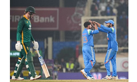 India's Kuldeep Yadav, back left, celebrates with Ravindra Jadeja, right, after taking the wicket of South Africa's Prenelan Subrayen during the first ODI cricket match of a series between India and South Africa, at JSCA International Stadium Complex, in Ranchi, Jharkhand, Sunday, Nov. 30, 2025 (PTI)&nbsp;