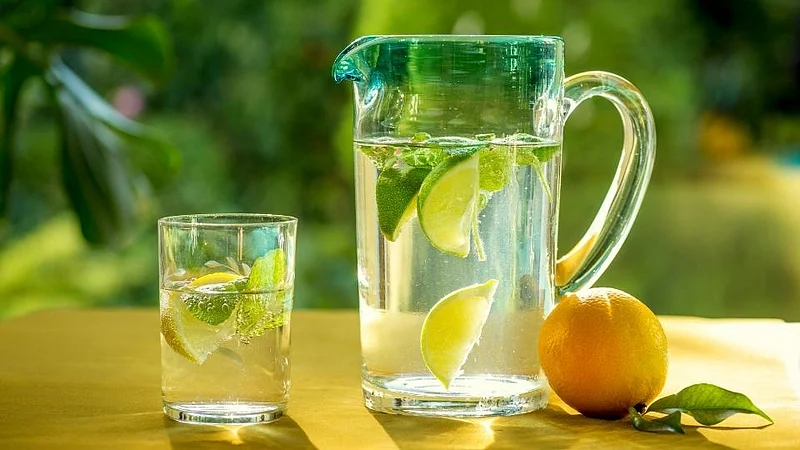 drinking a glass of lemonade