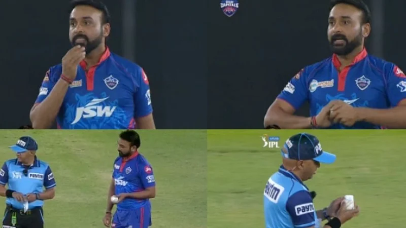 DC vs RCB : थुंकी लावताना सापडला; अंपायरने दिली वॉर्निंग (VIDEO)