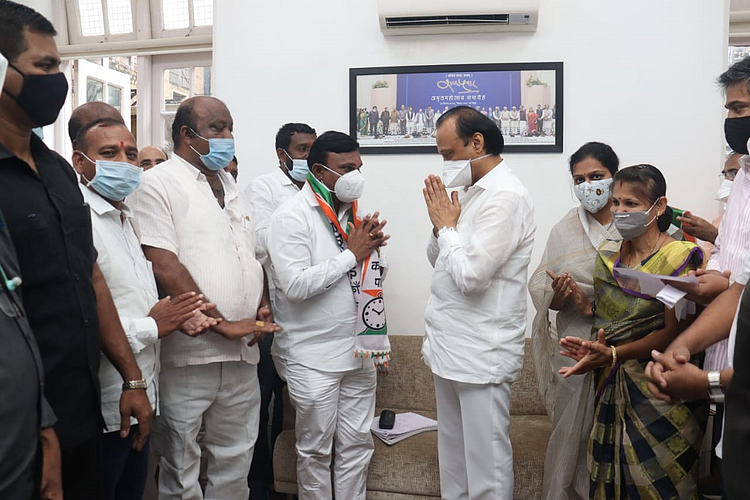 bjp leader mayor namdev raut joins ncp with four councilors and workers in karjat