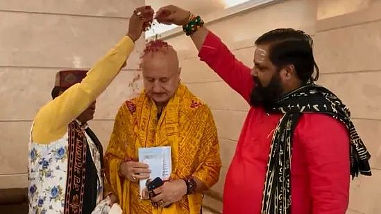 People performing puja for Anupam Kher at his residence.