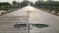 Pits in middle of road on bridge over river Bhima danger for transportation Pits in middle of road on bridge over river Bhima danger for transportation