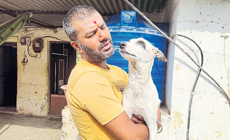 Purushottam Awhad with Saved Dog