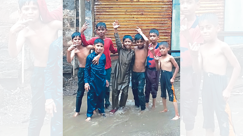 Children enjoying the first rain