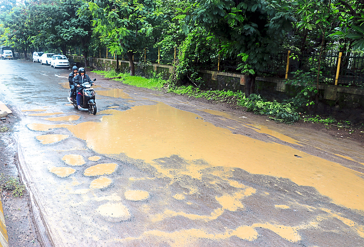 Potholes on service road latest rain news