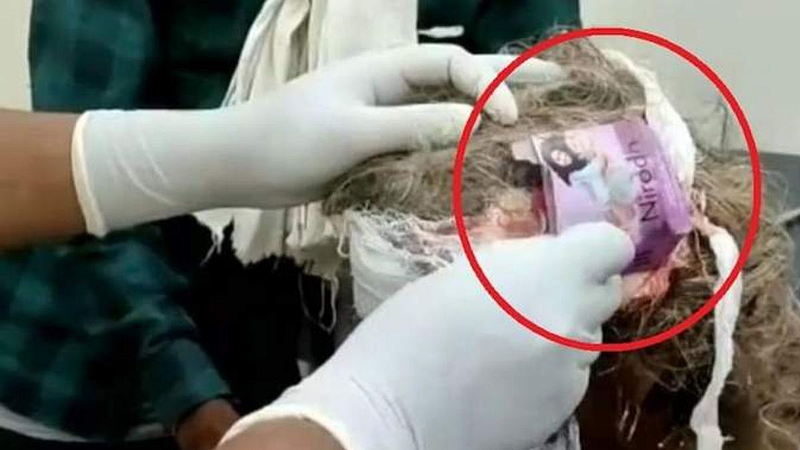(condom empty packet tied elderly woman head during dressing