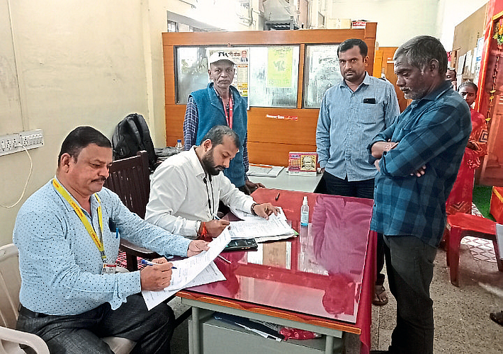 Staff during biometric registration of unregistered hawkers at West Divisional Office