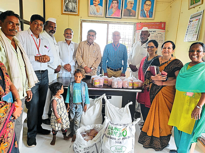 Social worker R while distributing materials to the adopted children in the integrated project office. P. Kuvar. Including Integrated Project Officer.