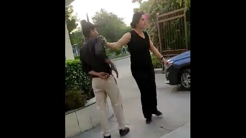 Viral video Woman arrested for abusing assaulting security guard in Noida society