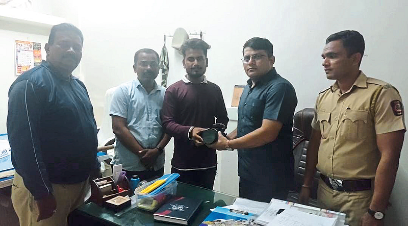 Sub-inspector Suraj Medhe handed over the found camera to the original owner