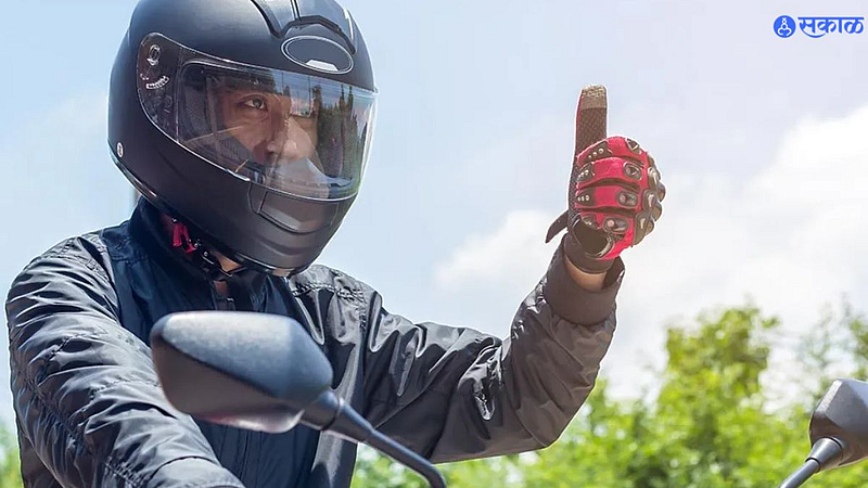 Two wheeler rider wearing helmet