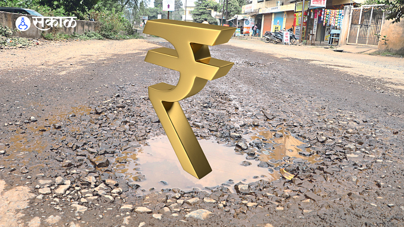 Potholes on the road between Bajrang Tunnel and SMIT College.