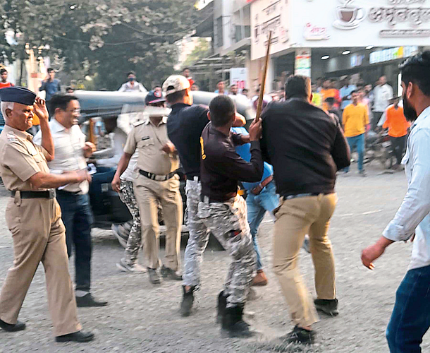 Police baton charge a youth who came to kill a suspect. In the second photo, police arresting one from the Govinda rickshaw stand.