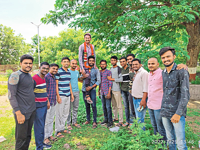 Fellow friends preparing for the competitive exam at Garuda Library cheered Prashant Jadhav on their shoulders for being selected as the Ministry Clerk.