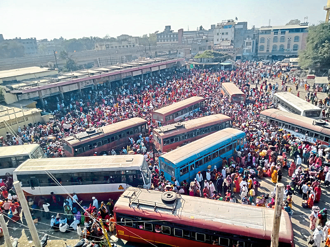 Crowd of passengers at the bus station here.