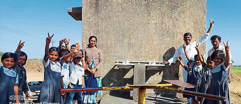 Students expressing their happiness over availability of water in Zilla Parishad school.