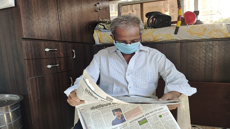 man reading paper