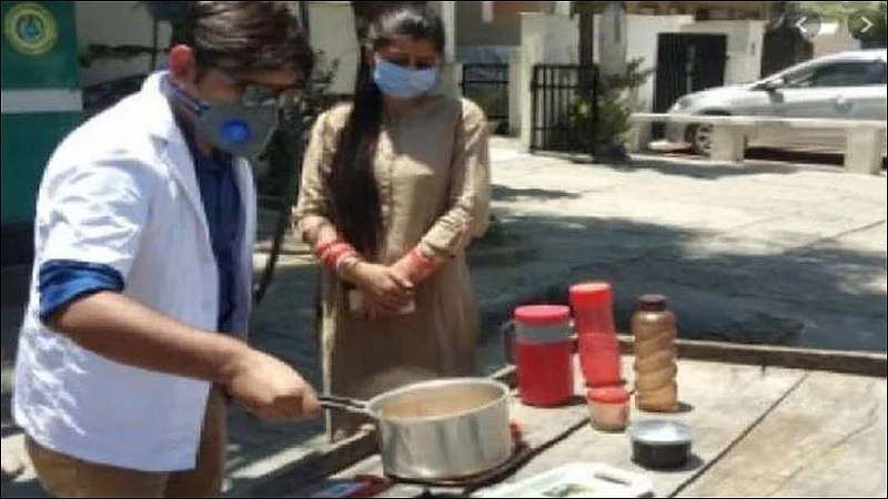 doctor selling tea with wife in front of hospital due to fired job at haryana