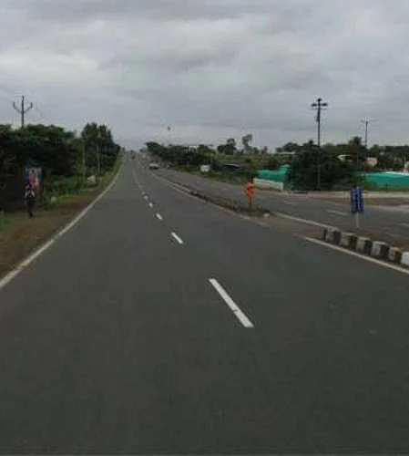 The state highway was demolished in many places even before the sidewalks were filled