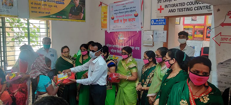 The service organization in Ambad distributes Diwali Farals and firecrackers to the needy on Diwali.jpg