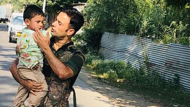 crpf soldiers save 3 year child from terrorist bullets