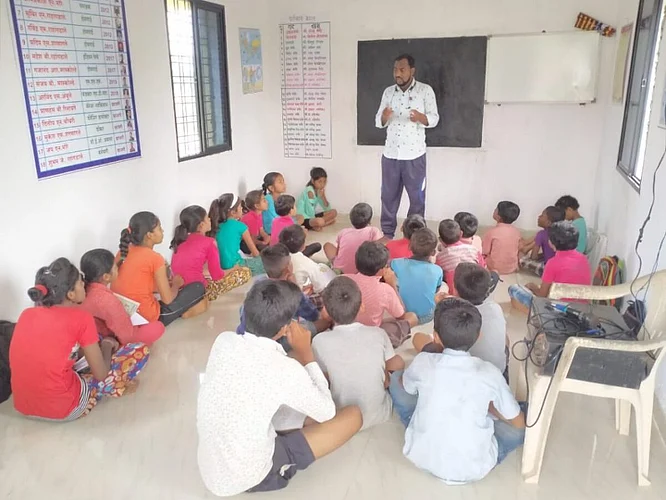 Software Engineer young man started school for students in the village