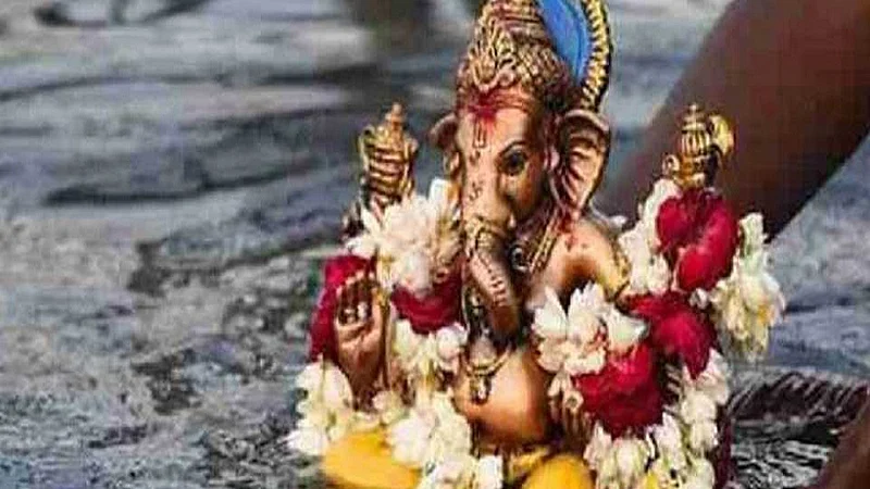Ganesha idol immersed in an artificial water tank in Baramati
