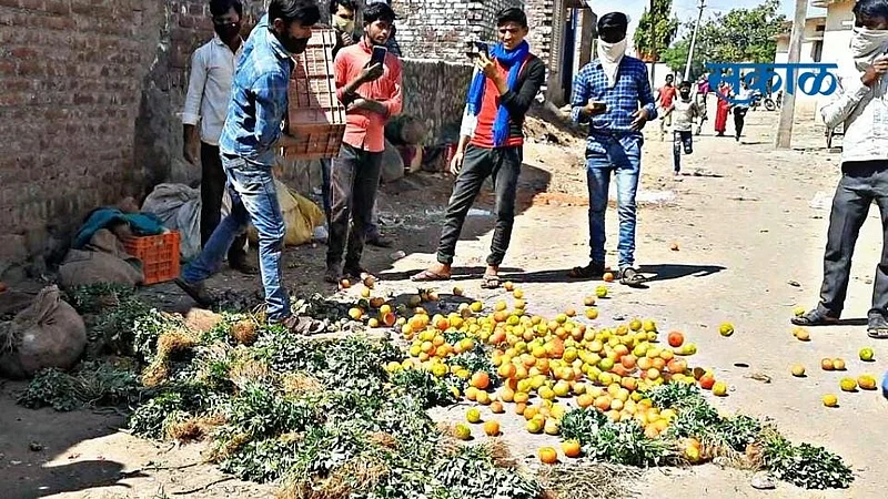 In Jintur angry farmers have thrown vegetables on the road as soon as the market closure was announced.jpg