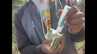 Cleaning Money With Hand Sanitizer.jpeg}