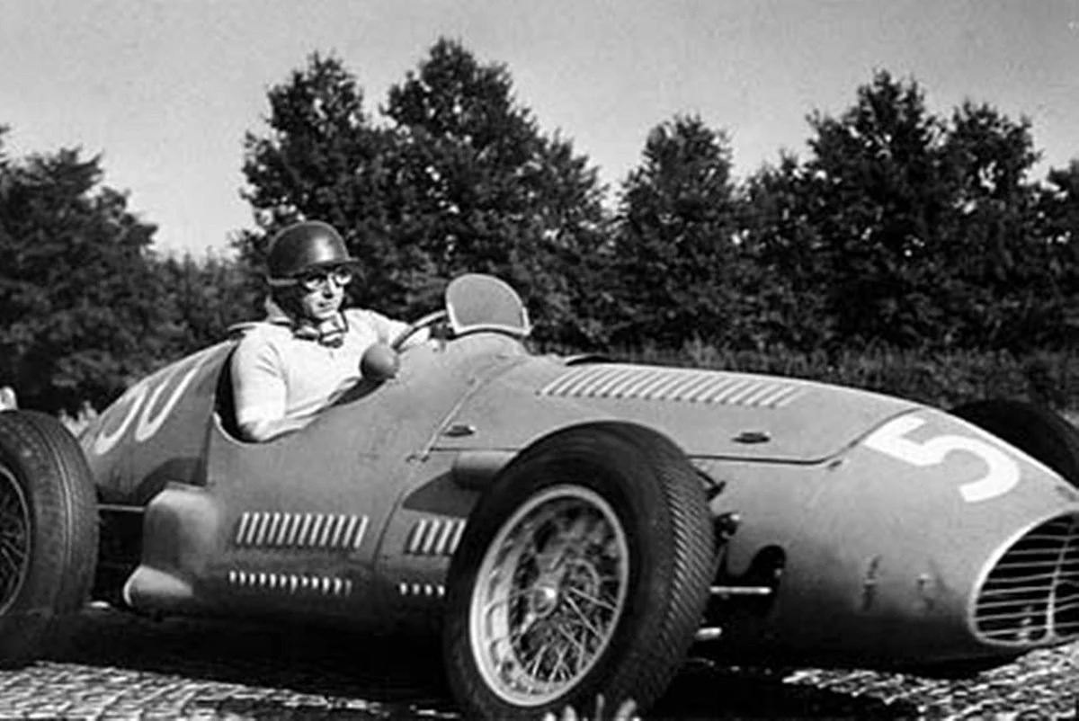 Juan Manuel Fangio pushing his Maserati to eventual victory at Monza, 1953