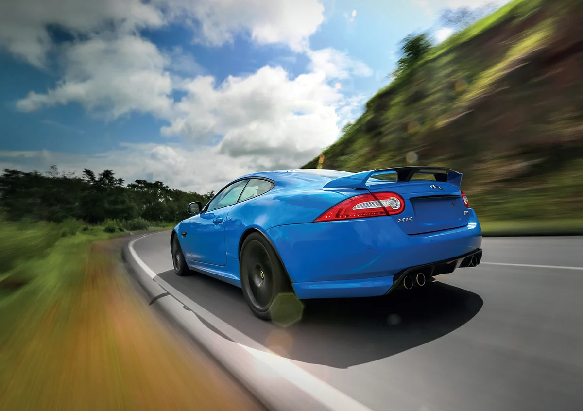 Massive carbon fibre diffuser, quad pipes and huge rear wing enhances the slightly deranged nature of the XKR-S