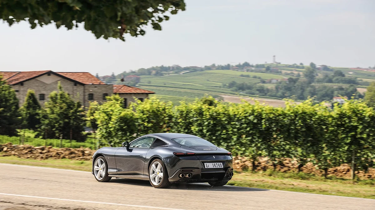 An active spoiler that has three positions and is activated by speed and the manettino setting