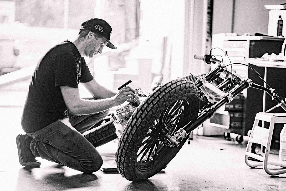 Johnny working on the race bike four days before the competiton