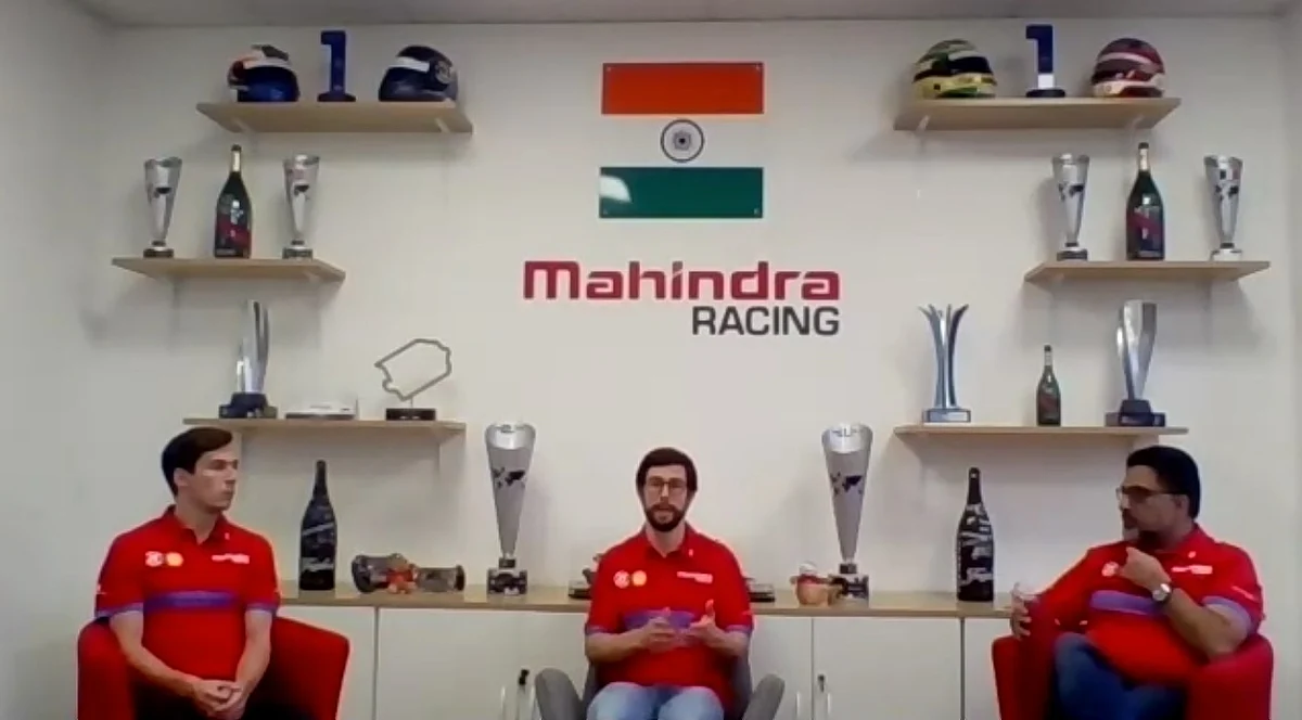 Alexander Simms (centre) speaks about the impact of sustainable motorsport, while teammate Alex Lynn (left) and team principal Dilbagh Gill look on